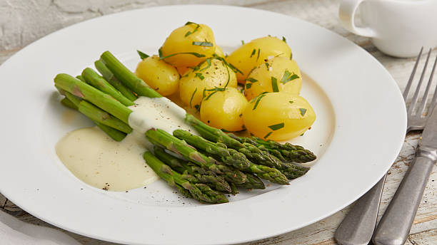 istock Green asparagus with boiled potatoes 2231061989