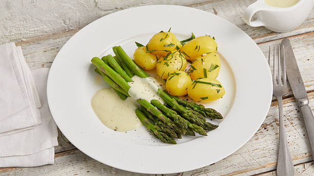 istock Green asparagus with boiled potatoes 2231061993