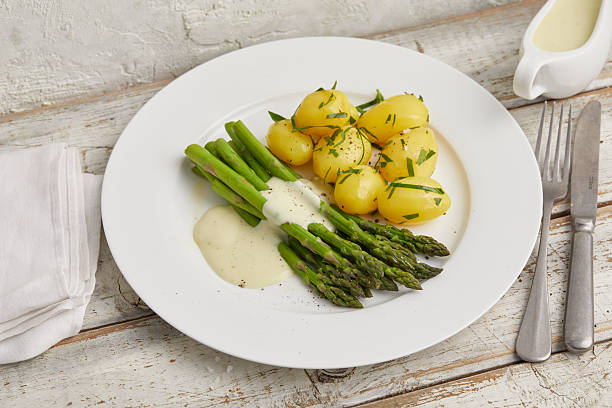 istock Green asparagus with boiled potatoes 2231061999