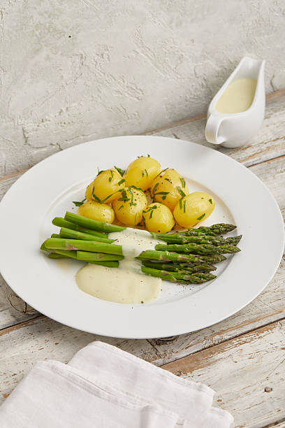 istock Green asparagus with boiled potatoes 2231062003