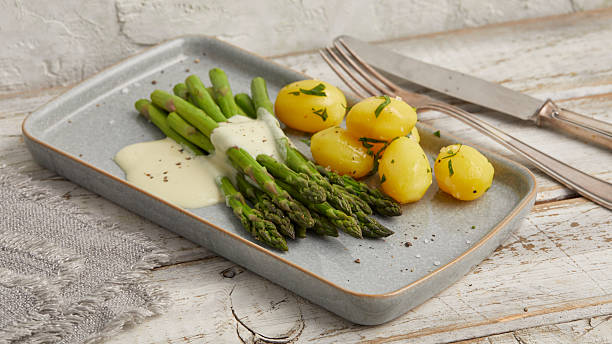 istock Green asparagus with boiled potatoes 2231062005