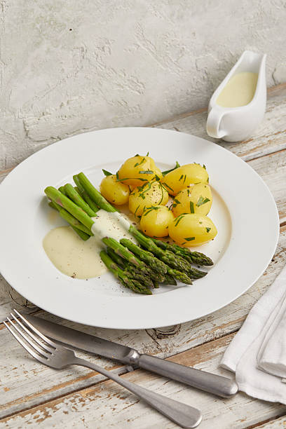 istock Green asparagus with boiled potatoes 2231062009