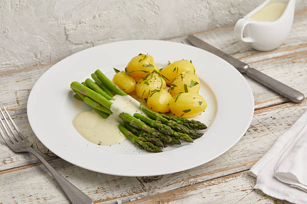 istock Green asparagus with boiled potatoes 2231062010
