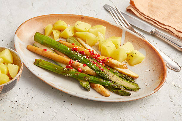 istock Baked asparagus with potatoes 2231062071