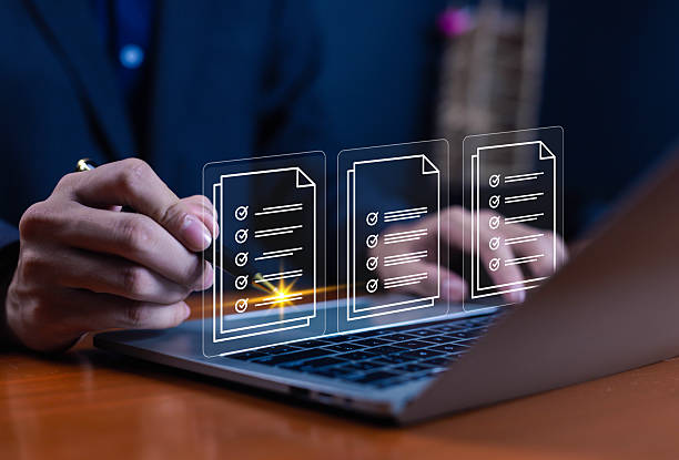 istock Businessman working on computer using laptop business performance tracking and evaluation concept. Filling out online surveys. Digital form checklist 2231064172
