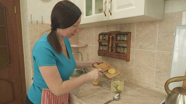istock Preparing a Refreshing and Zesty Lemon Drink Within a Sleek, Modern Kitchen Space Today 2231064379