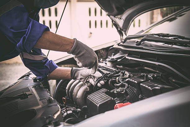 istock Car care maintenance and servicing, Close-up hand technician auto mechanic using the wrench to repairing change spare part car engine problem and car insurance service support. 2231069328