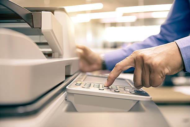 istock Photocopier printer, Close up hand office man press copy button on panel to using the copier or photocopy machine for scanning document or printing a sheet paper and xerox photocopy. 2231069829