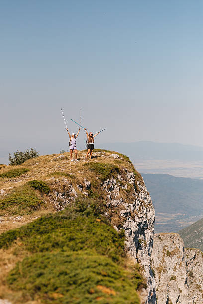 istock Hikers celebrating on mountain cliff 2231072502
