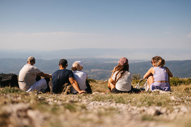 istock Group of hikers resting on mountain top 2231074770