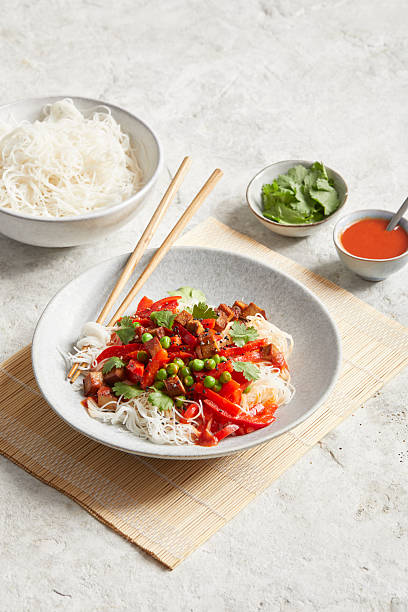 istock Rice noodles with chili paste and tomatoes 2231074913