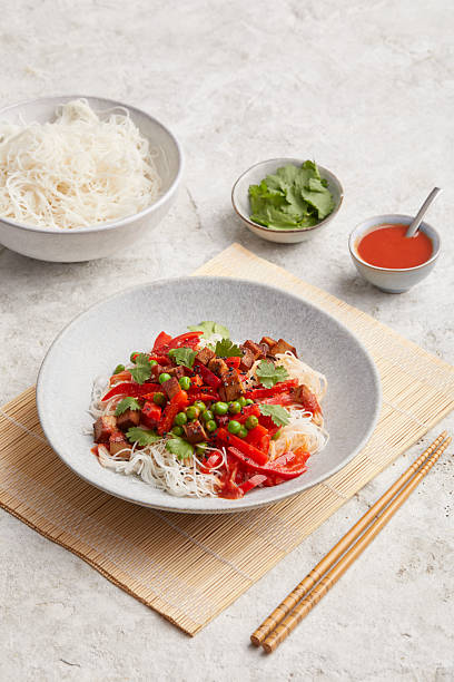 istock Rice noodles with chili paste and tomatoes 2231074915