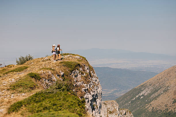 istock Two women hiking on rocky hill 2231075122