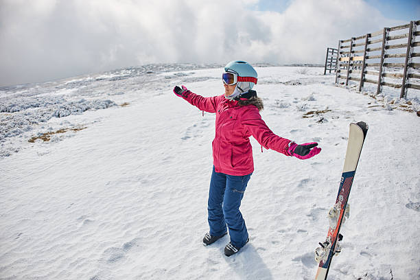 Young adult woman on skiing. Copy space.