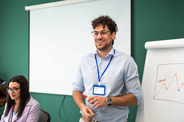 istock Businessman Showing  and Explaining a Presentation on Whiteboard. 2231081873