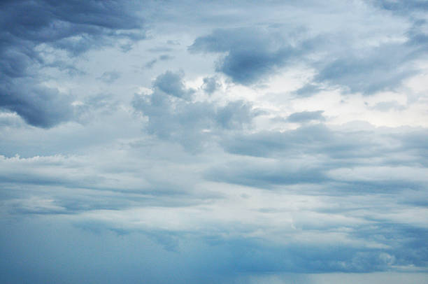 Beautiful storm clouds on a summer night with pinks and blues.