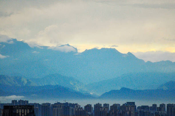landscape with mountains and clouds in sunset