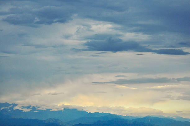 landscape with mountains and clouds in sunset