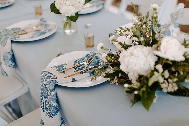 istock Elegant table setting with floral centerpiece. 2231082558