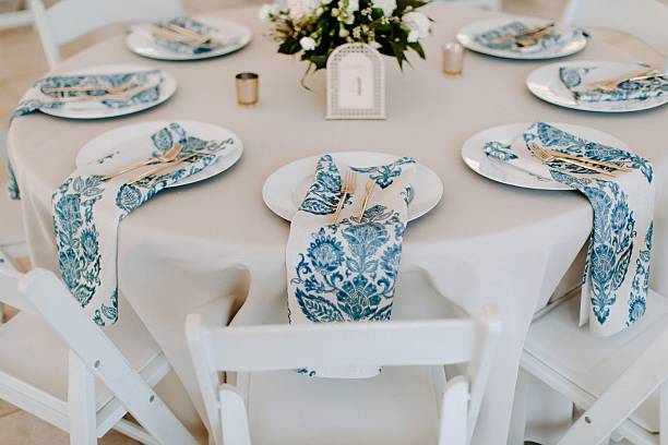 istock Elegant table setting with blue floral napkins. 2231082565