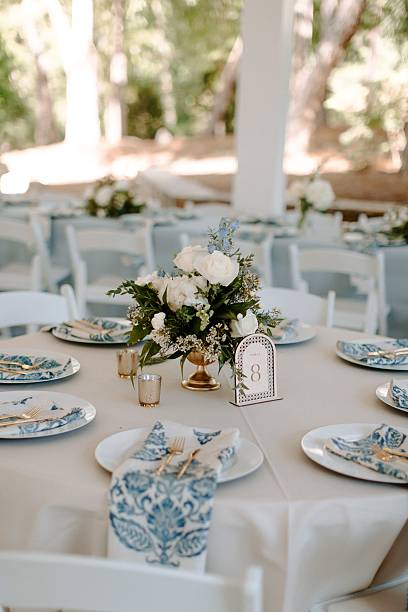 istock Elegant outdoor table setting with floral centerpiece. 2231082593