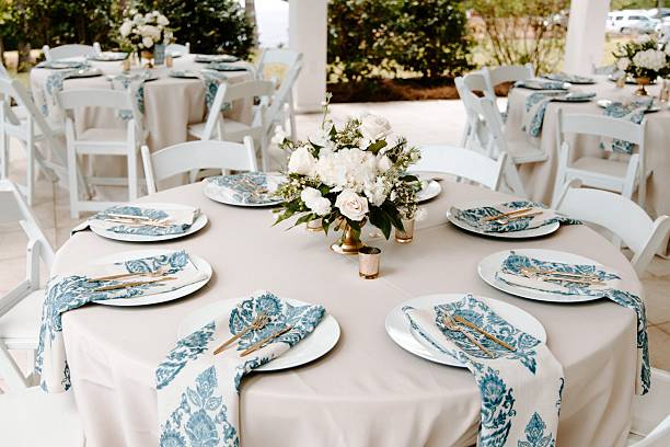 istock Elegant wedding table setting with floral centerpiece. 2231082599