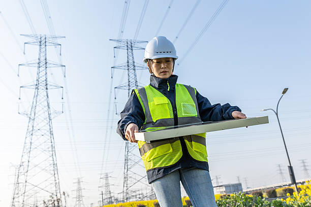 istock Female engineer holding solar panels working in the field 2231090662