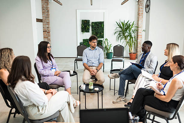 istock Group of Colleagues Discussing Project in Conference Room 2231093073