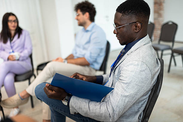 istock Businessman Reviewing Document During Meeting 2231093079