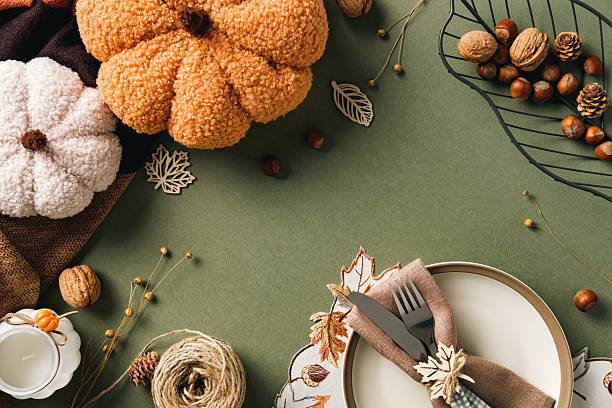 istock Elegant fall table setting with plush pumpkins, nuts, pinecones, and rustic decor. Happy Thanksgiving concept. 2231093808