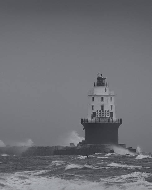 istock Harbor of Refuge Lighthouse in a Storm 2231099590