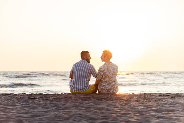 istock Couple enjoying a scenic seaside sunset on a peaceful beach 2231099909