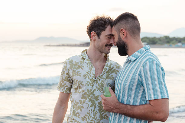 istock Romantic couple enjoys sunset moment on the beach 2231100168