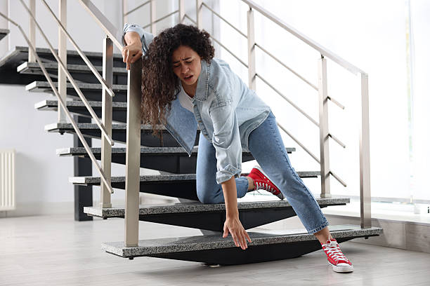 istock Woman falling on stairs in building. Dangerous accident 2231103477
