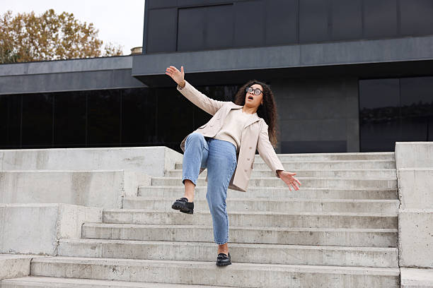 istock Woman falling on stairs outdoors. Dangerous accident 2231103732