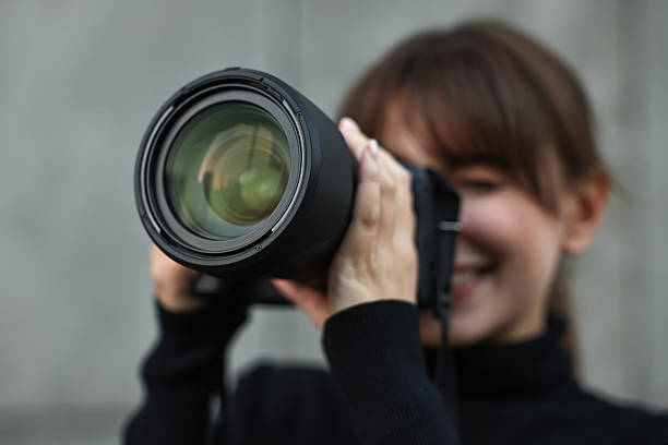 istock Professional photographer taking picture with camera outdoors, selective focus 2231104163