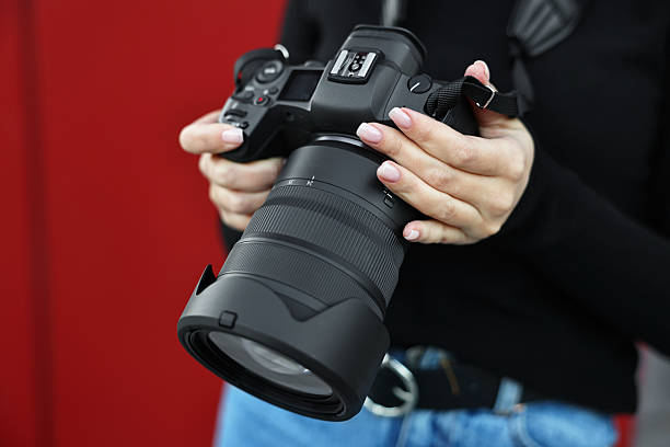 istock Professional photographer with digital camera outdoors, closeup 2231104190