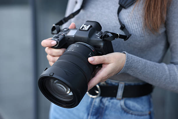 istock Professional photographer with digital camera outdoors, closeup 2231104263