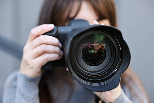 istock Professional photographer taking picture with camera outdoors, selective focus 2231104270
