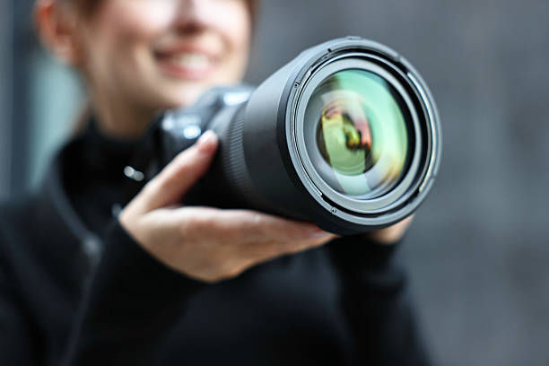 istock Professional photographer taking picture with camera outdoors, closeup 2231104327