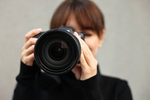 istock Professional photographer taking picture with camera outdoors, selective focus 2231104363