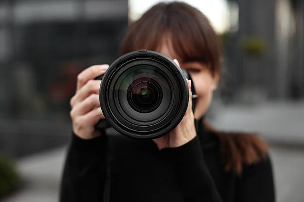 istock Professional photographer taking picture with camera outdoors, selective focus 2231104371