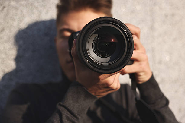 istock Professional photographer taking picture with camera outdoors, selective focus 2231106600