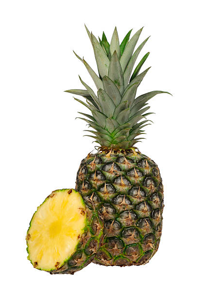 istock Sliced and Whole Fresh Pineapple Showing Juicy Yellow Inside on a White Background 2231109245
