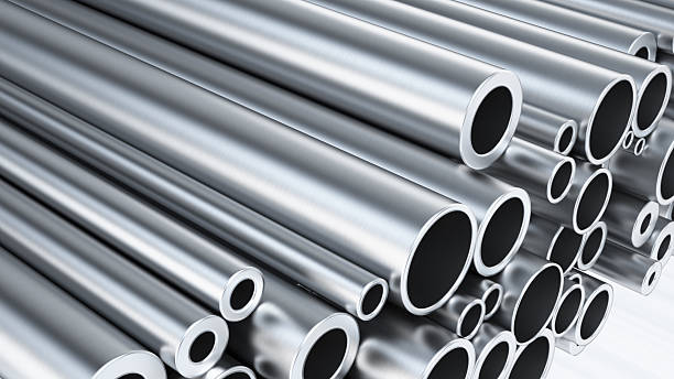 istock Stainless steel tubes stacked in a warehouse showcasing various patterns and textures in a well-lit space 2231109292