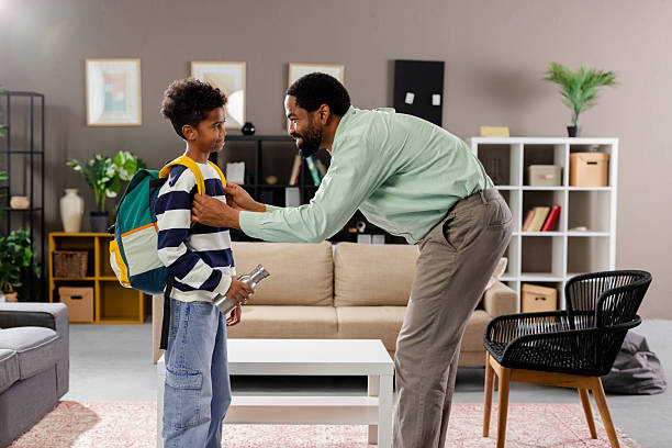 istock Caring father helping son getting ready for school at home 2231110978