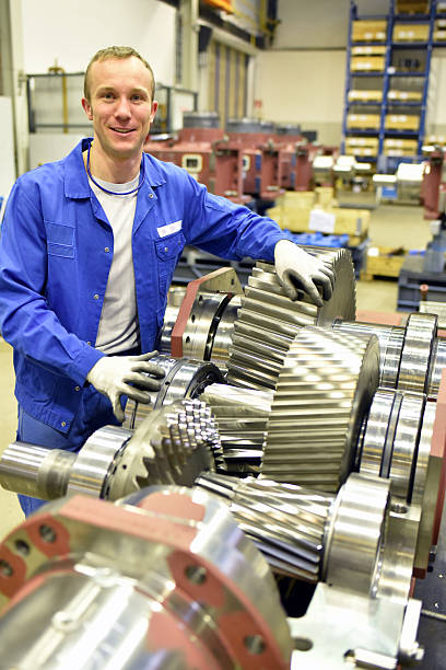 istock portrait of young cheerful workers in mechanical engineering 2231112981