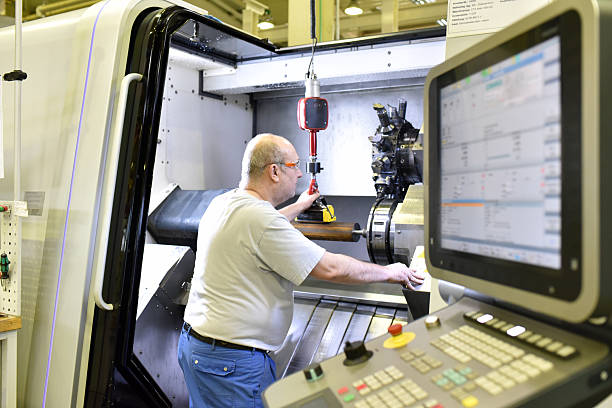 istock cnc machine in modern industrial mechanical engineering - workers at the workplace 2231113000