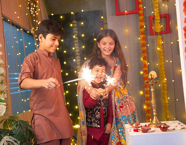 istock Friends enjoying with sparklers at home during Diwali 2231118659