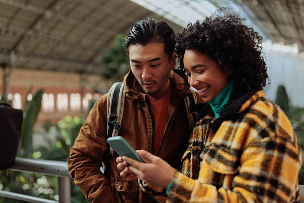 istock Tourists using smart phone app for visiting the city 2231123406